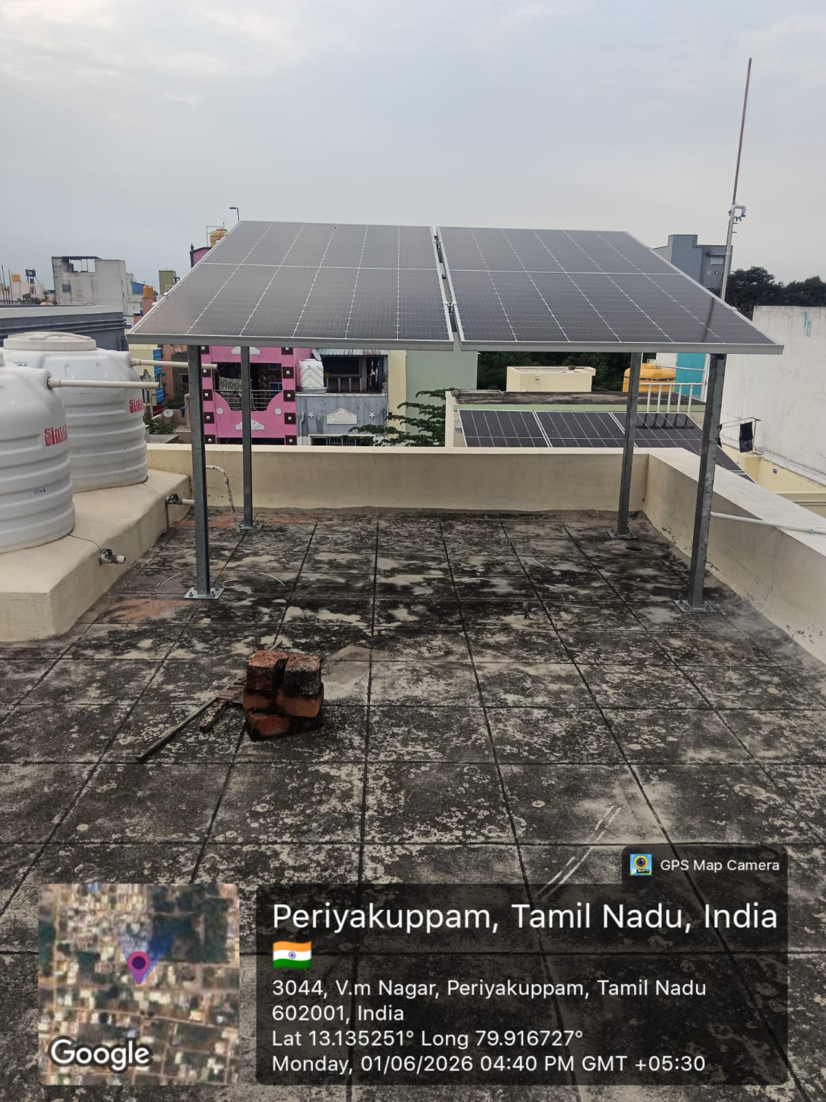 Solar panel installation at V.M Nagar, Periyakuppam — elevated terrace solar structure.