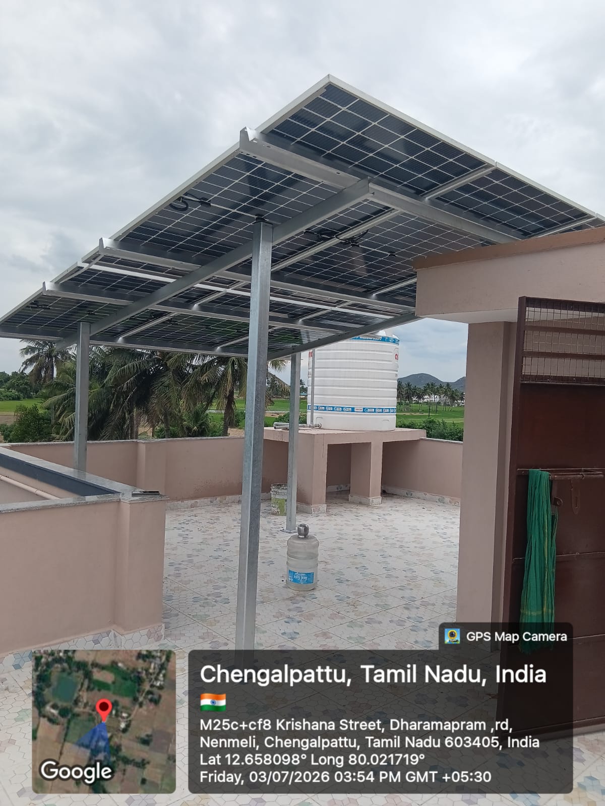 Solar panel installation at Nenmeli, Chengalpattu — twin-row elevated rooftop canopy.