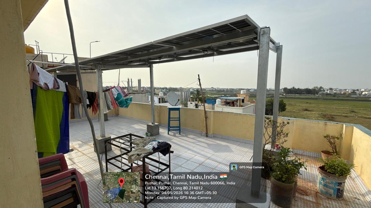 Solar panel installation at Puzhal, Chennai — compact elevated terrace solar structure.