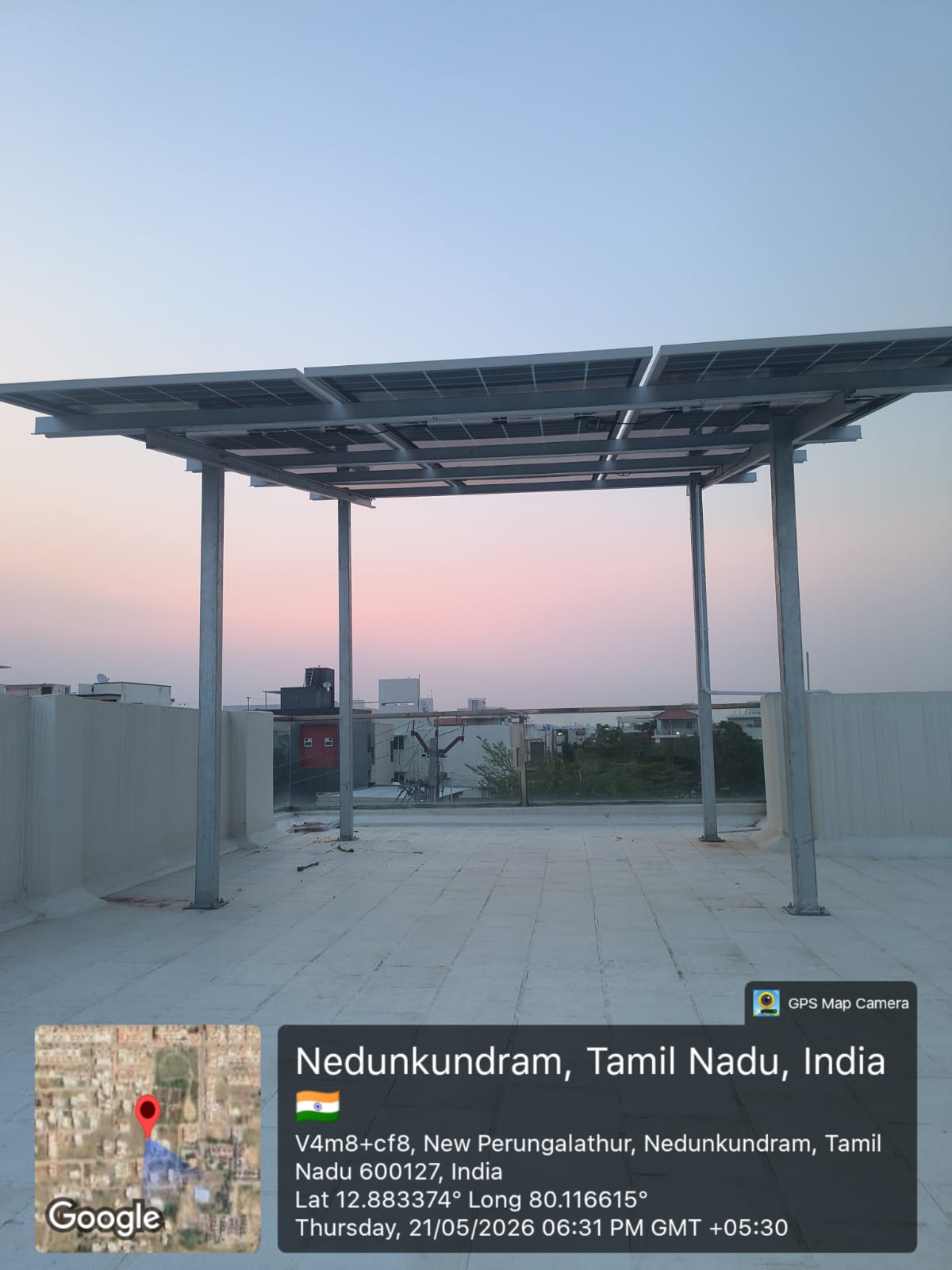 Solar panel installation at Nedunkundram, New Perungalathur — full-terrace elevated array.