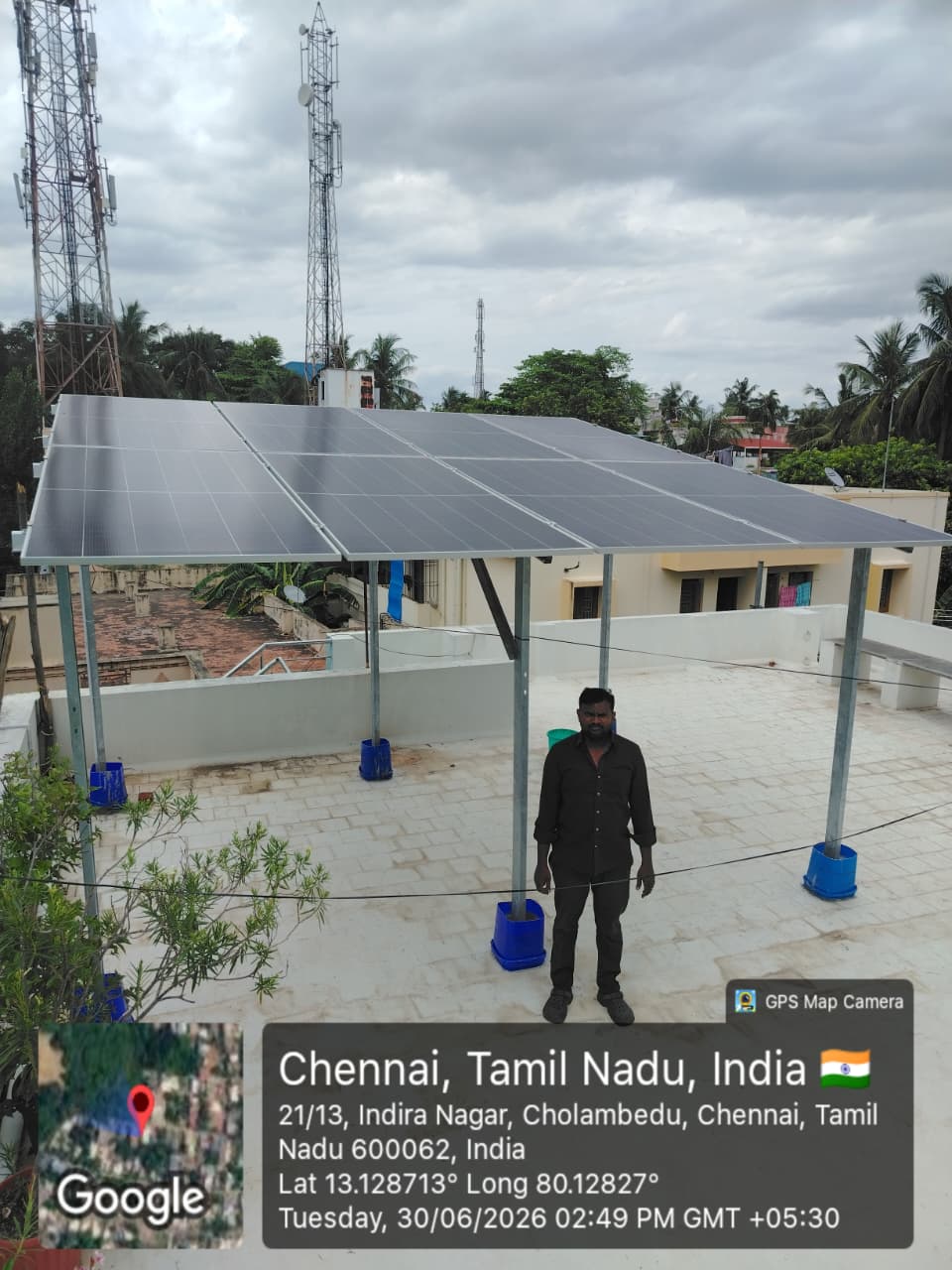 Solar panel installation at Cholambedu, Chennai — high-clearance elevated rooftop array.