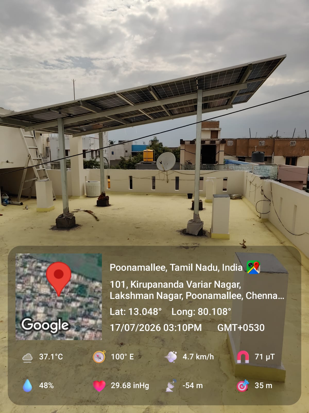 Solar panel installation at Poonamallee, Chennai — steep-tilt elevated rooftop array.