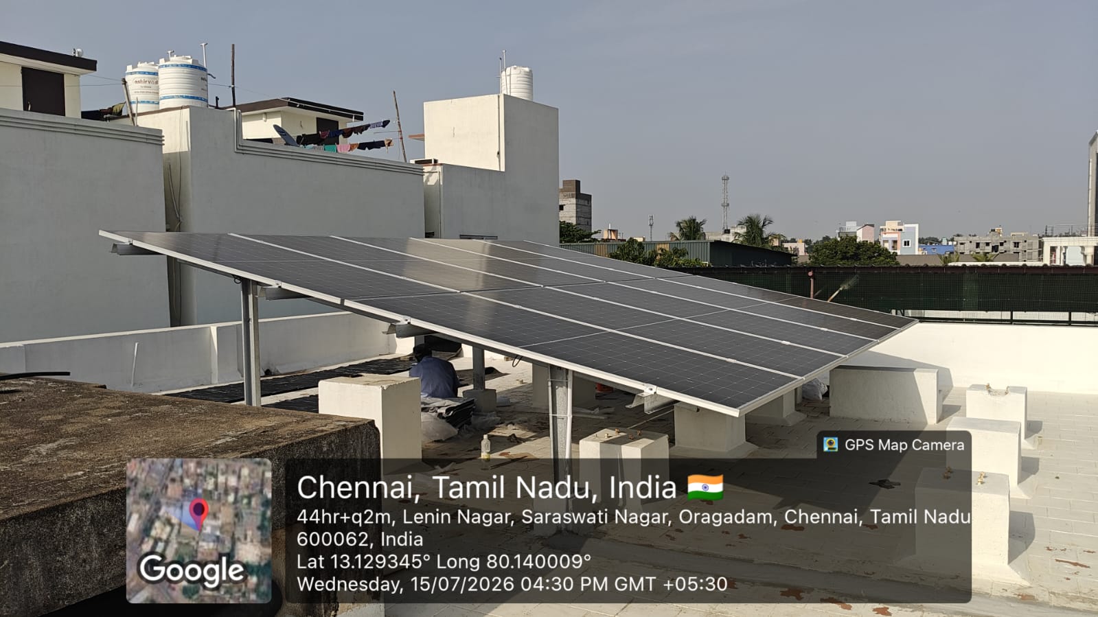 Solar panel installation at Oragadam, Chennai — tilt-mounted rooftop array on terrace.