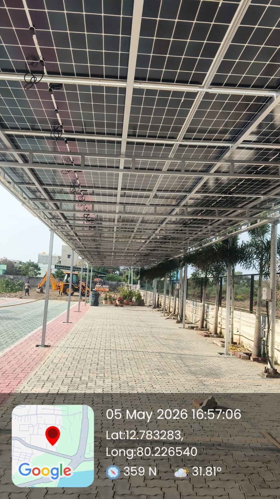 Solar panel installation at Kelambakkam — long walkway solar canopy for a commercial campus.